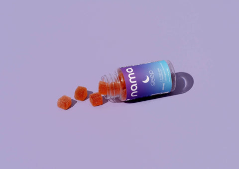 nama sleep melatonin gummies with gummies on side with purple background